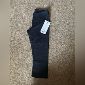 Studio Hatha capri leggings. Size medium, black, new with tags on.